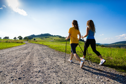 Nordic walking - active people working out outdoor